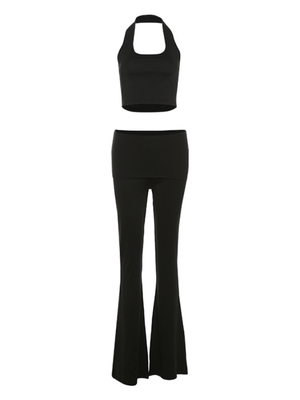 Chic halter neck crop top and flared pants set in solid black, polyester fabric.