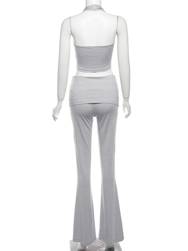 Chic halter neck crop top and flared pants set, solid color, polyester-knit fabric.