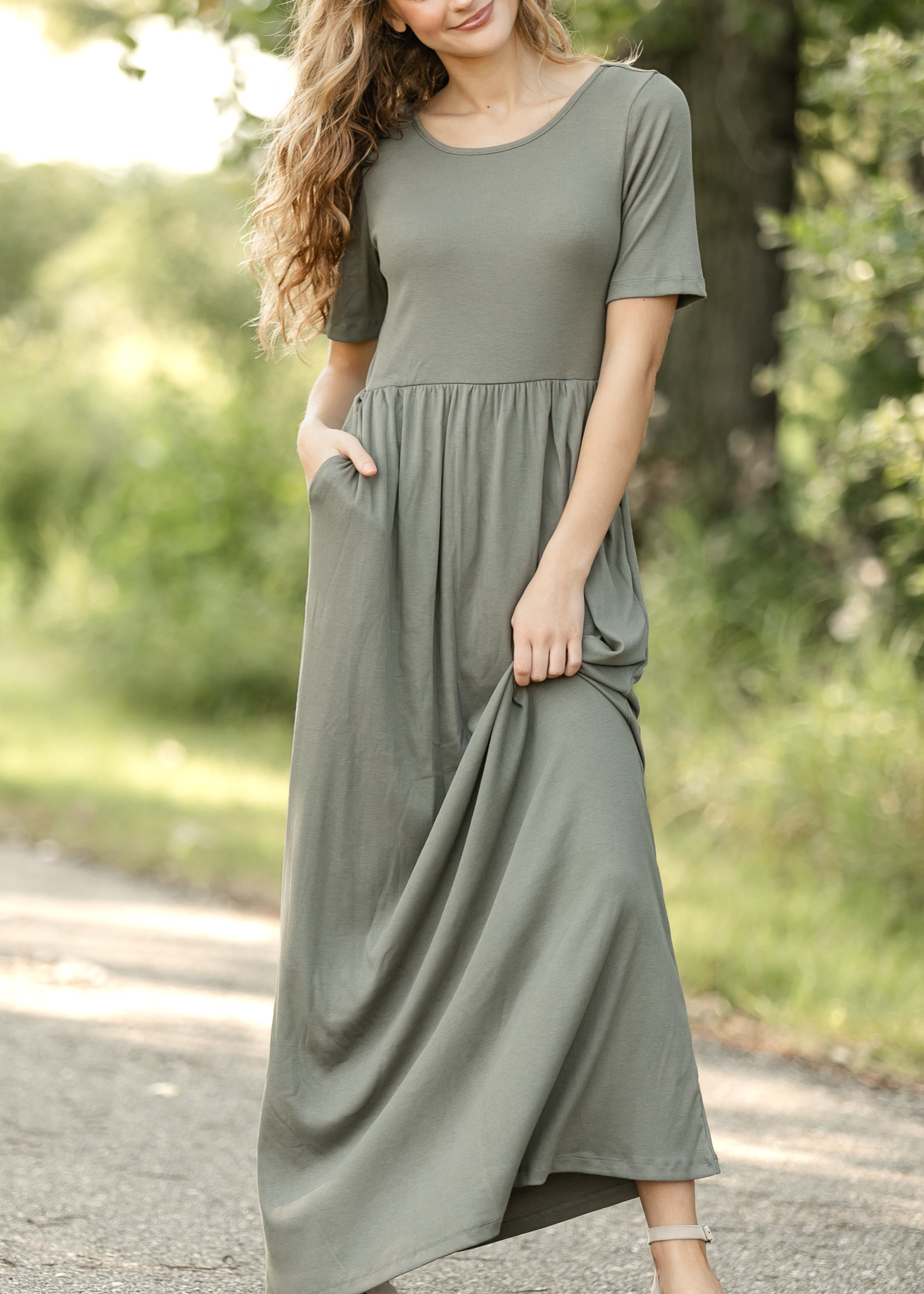 Inherit Co. Jasmine Olive Ribbed Maxi Dress, showcasing the soft, textured fabric and elegant drape.