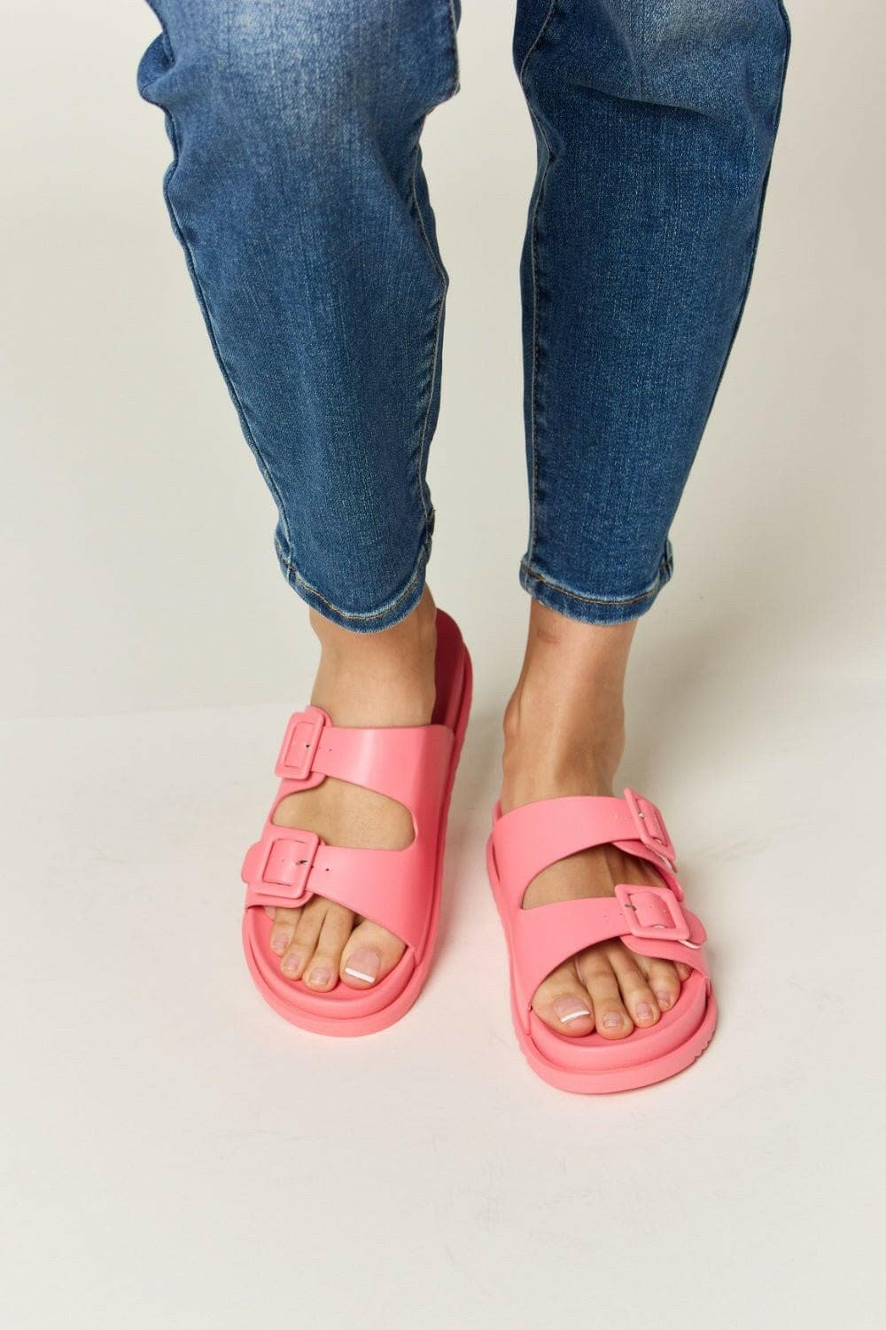 Elegant dual buckle open toe sandals for style and comfort.