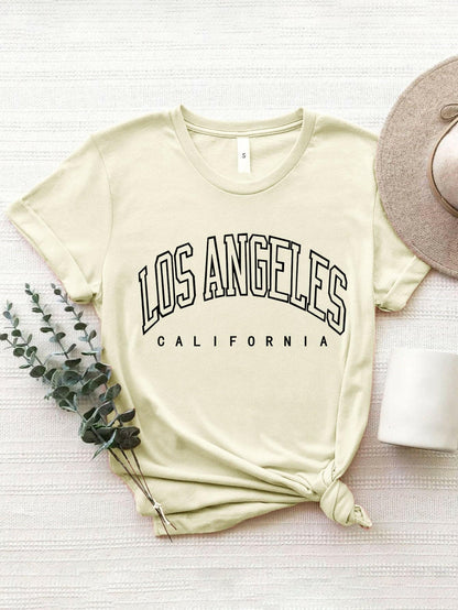 City of Angels California Round Neck TeeCity of Angels California Round Neck Tee
 Upgrade your style game with the City of Angels California Round Neck Tee, a perfect fusion of comfort and chic. This tee iLove Salve Angels California Round Neck TeeGraphic