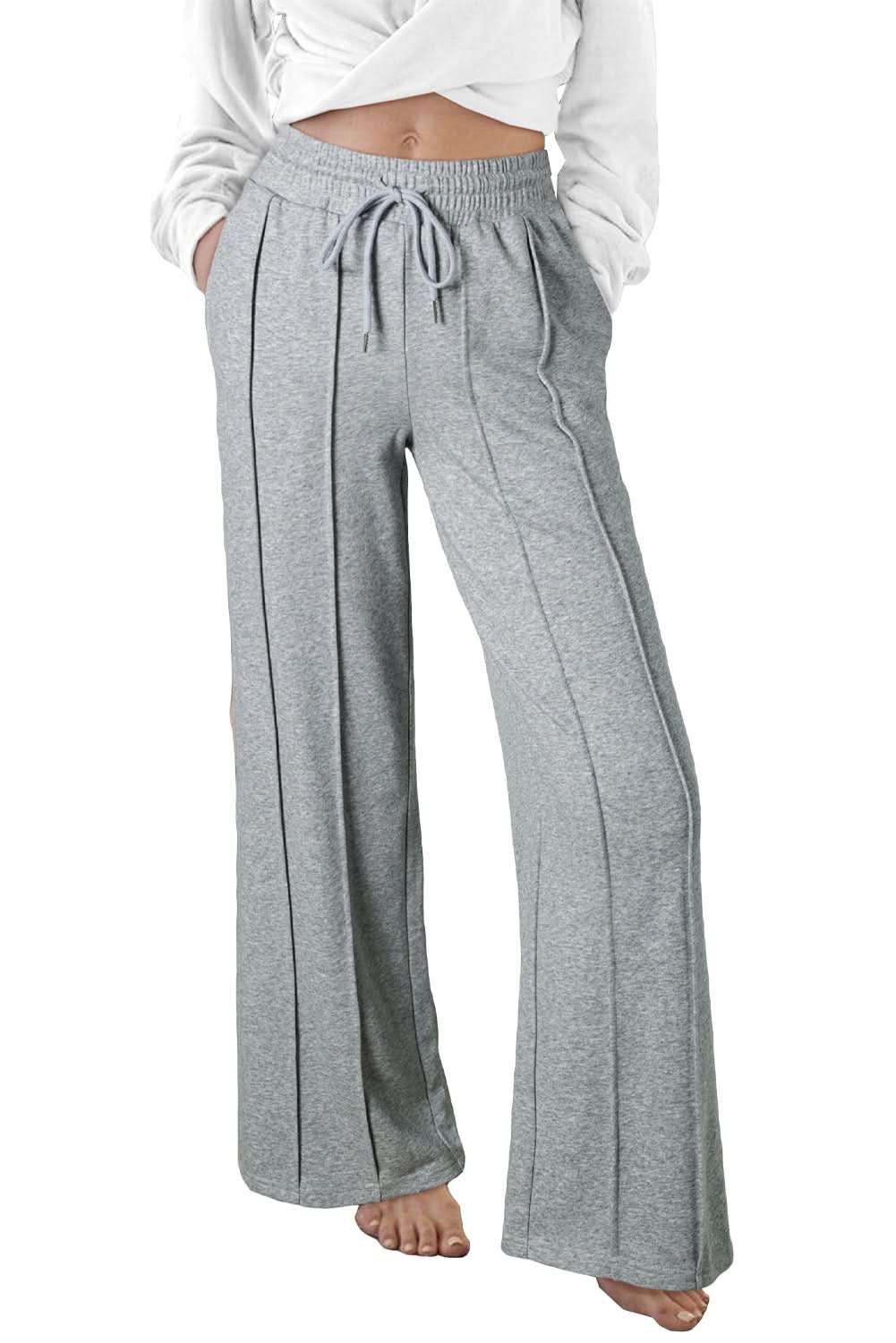 Gray wide leg sweatpants with seamed detailing and a drawstring high waist.