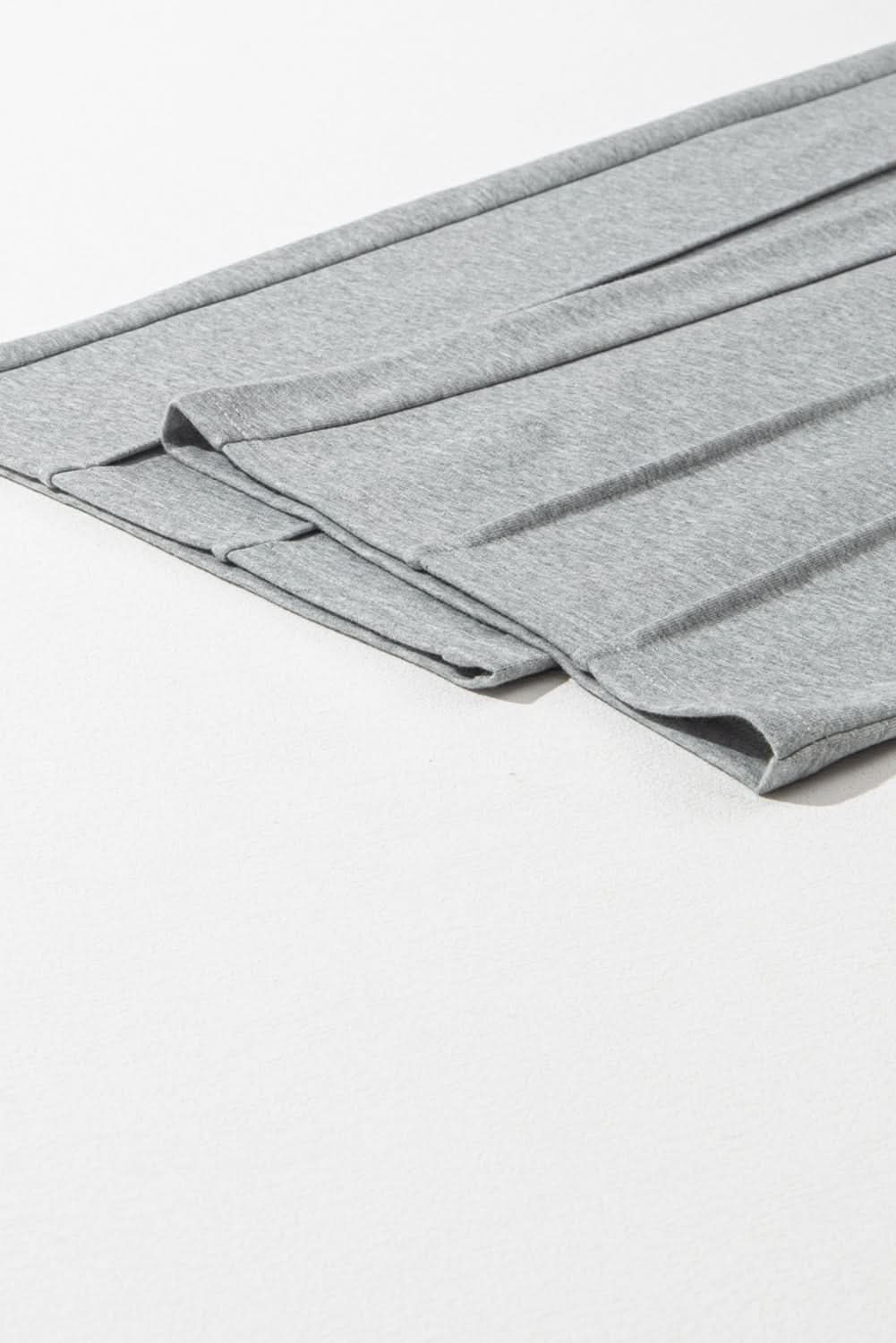 Chic gray wide leg sweatpants with seamed detail and drawstring waist.