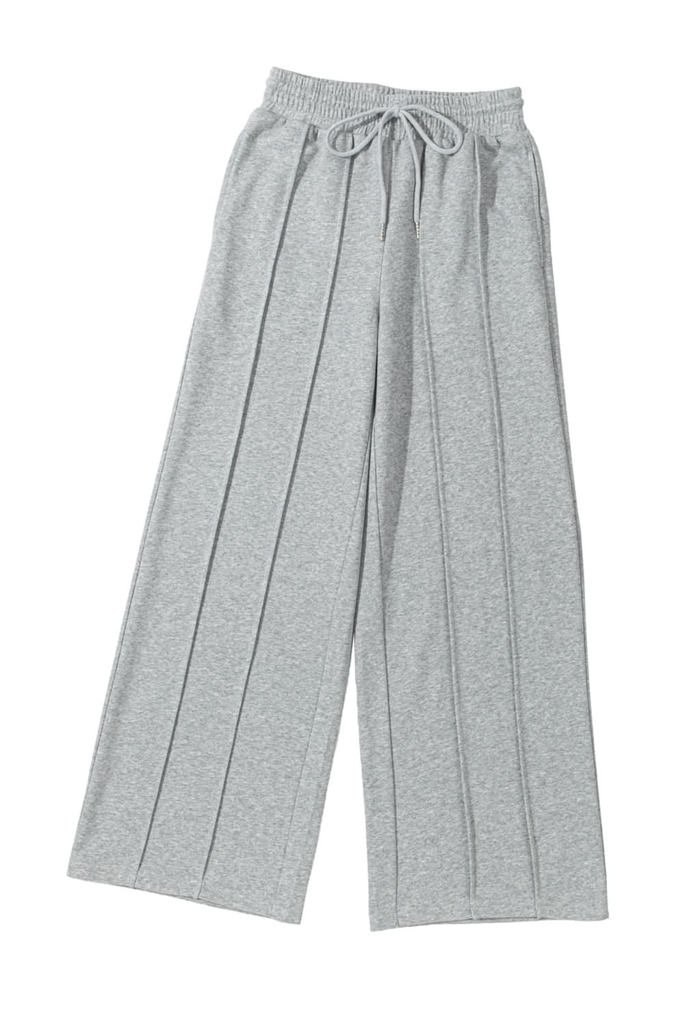 Gray wide leg sweatpants with seamed detailing and drawstring high waist.