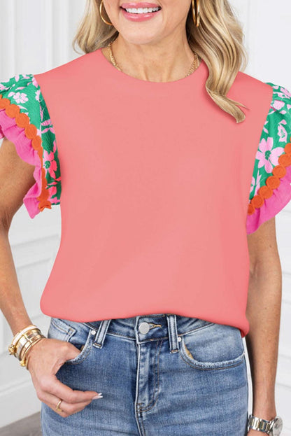 Peach blossom floral top with ricrac sleeves and modern fit.