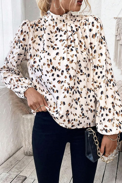 White leopard print lantern sleeve mock neck pleated blouse.