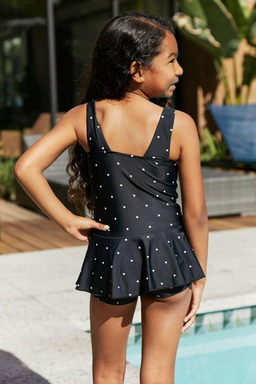 Elegant Black and White Polka Dot Swimsuit Dress by Marina West SwimExperience Timeless Elegance
 Unveil your charm this summer with the Elegant Black and White Polka Dot Swimsuit Dress by Marina West Swim. This exquisite swim dress Love Salve White Polka Dot Swimsuit Dressswimwear