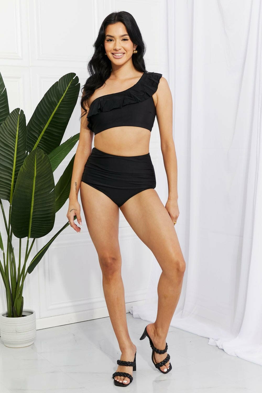 Seaside Serenade One-Shoulder Ruffle Bikini Set in Black by Marina WesExperience Elegance with the Seaside Serenade One-Shoulder Ruffle Bikini Set
 Step into a world of sophistication and style with the Seaside Serenade One-Shoulder RuLove Salve -Shoulder Ruffle Bikini Setswimwear