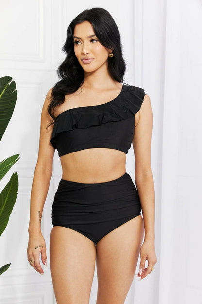 Seaside Serenade One-Shoulder Ruffle Bikini Set in Black by Marina WesExperience Elegance with the Seaside Serenade One-Shoulder Ruffle Bikini Set
 Step into a world of sophistication and style with the Seaside Serenade One-Shoulder RuLove Salve -Shoulder Ruffle Bikini Setswimwear