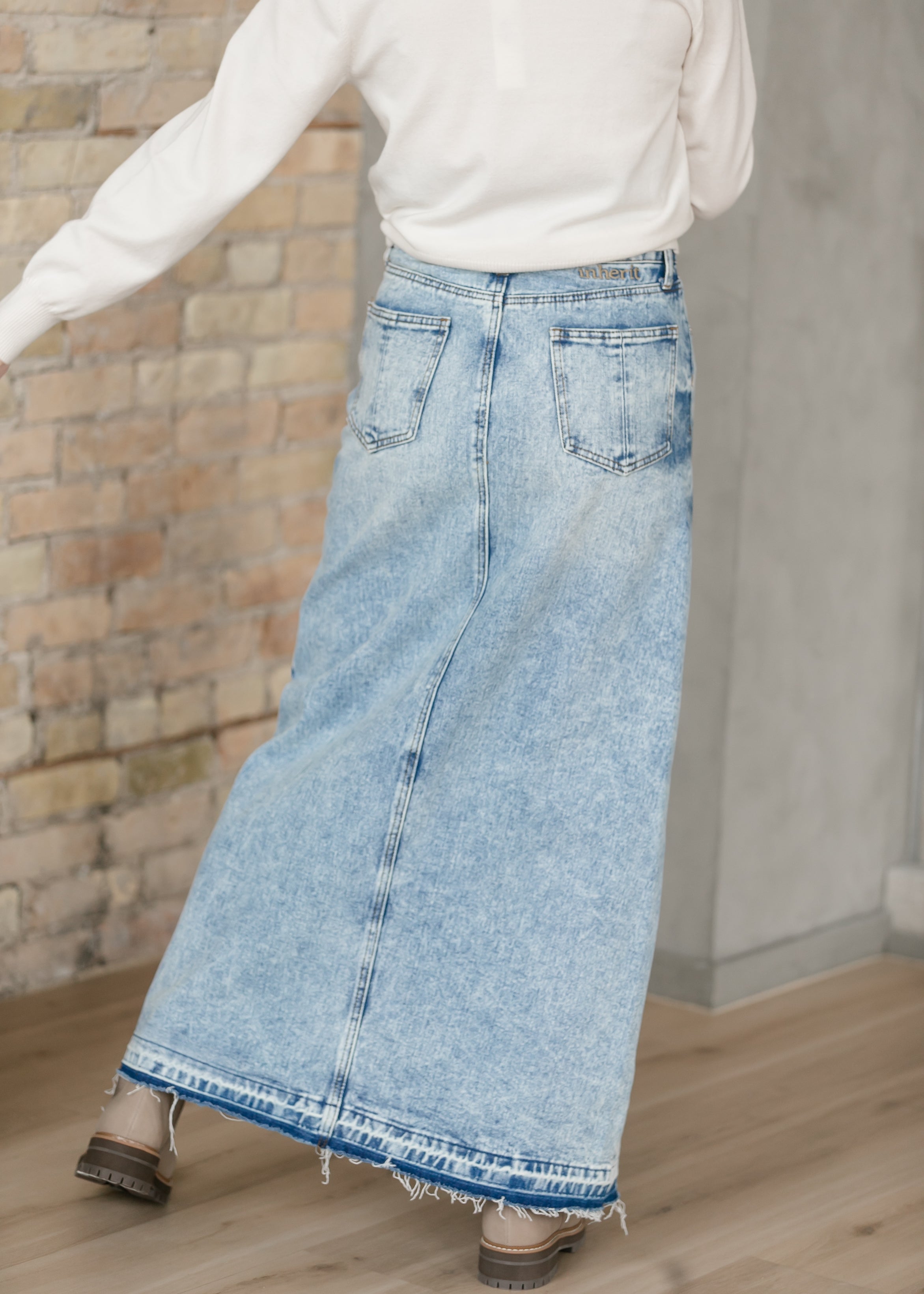 Detailed close-up of Inherit Co. Mina Denim Maxi Skirt's premium denim fabric, highlighting its quality texture and durable weave.
