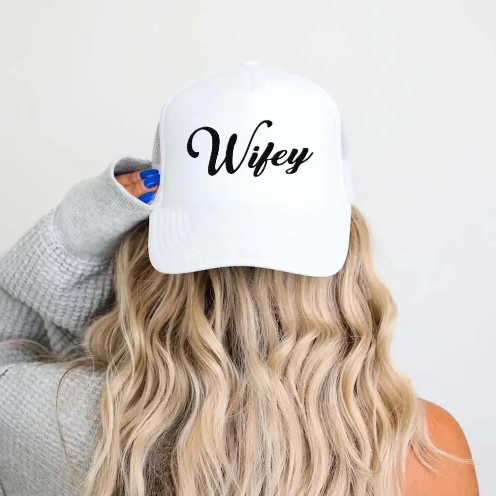 The Adorb.co Wifey embroidered cap laid flat, showcasing its clean design and durable materials for everyday wear.