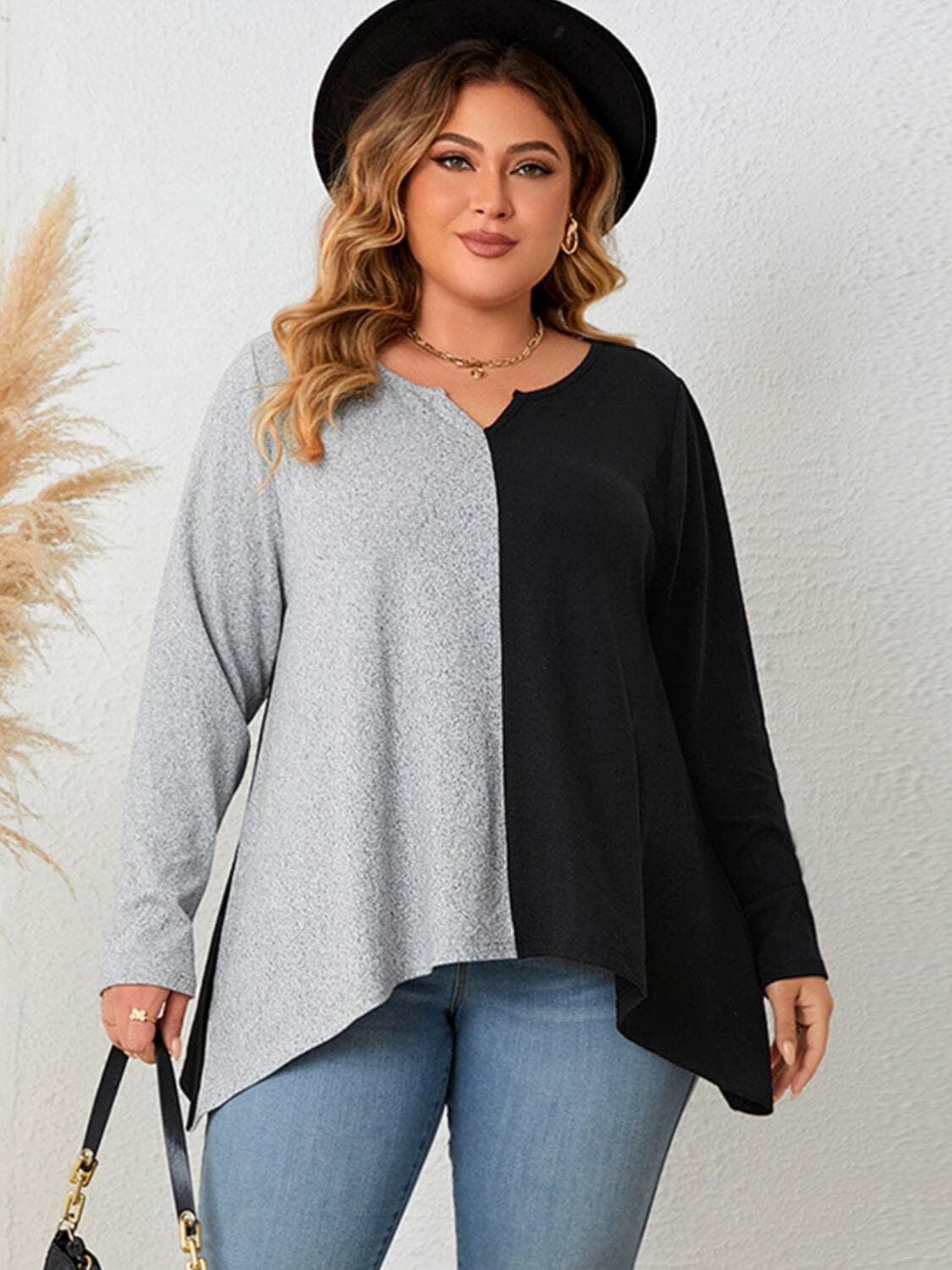 Plus size notched neck tee with contrast design, sheer details, and comfortable stretch.