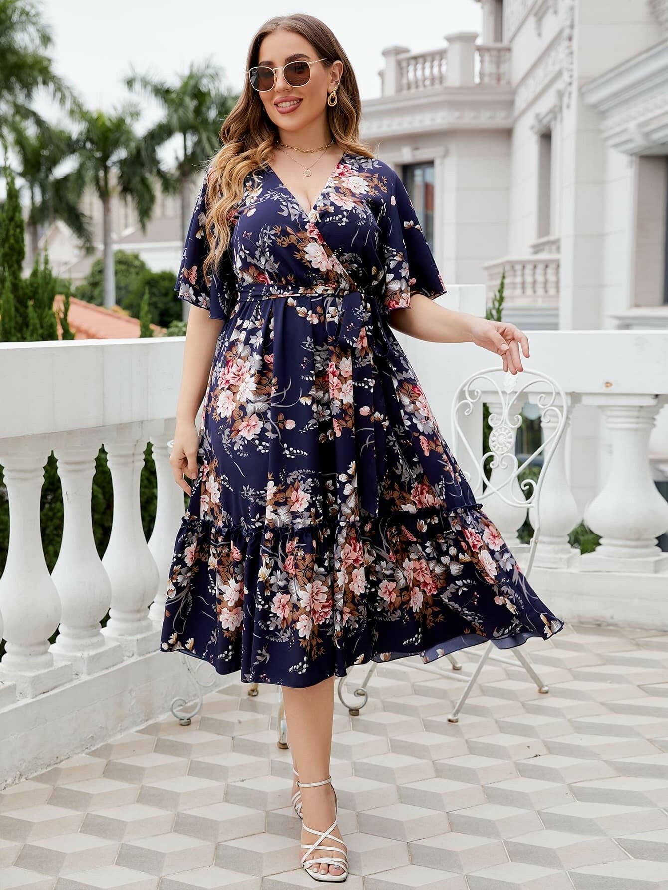 Floral Print Plus Size Midi Dress with Surplice NecklineUpgrade Your Wardrobe with a Stunning Floral Midi Dress
 
 Embrace modern style with a charming floral print
 Surplice neckline and frill details add a touch of elegLove Salve Size Midi Dressplus