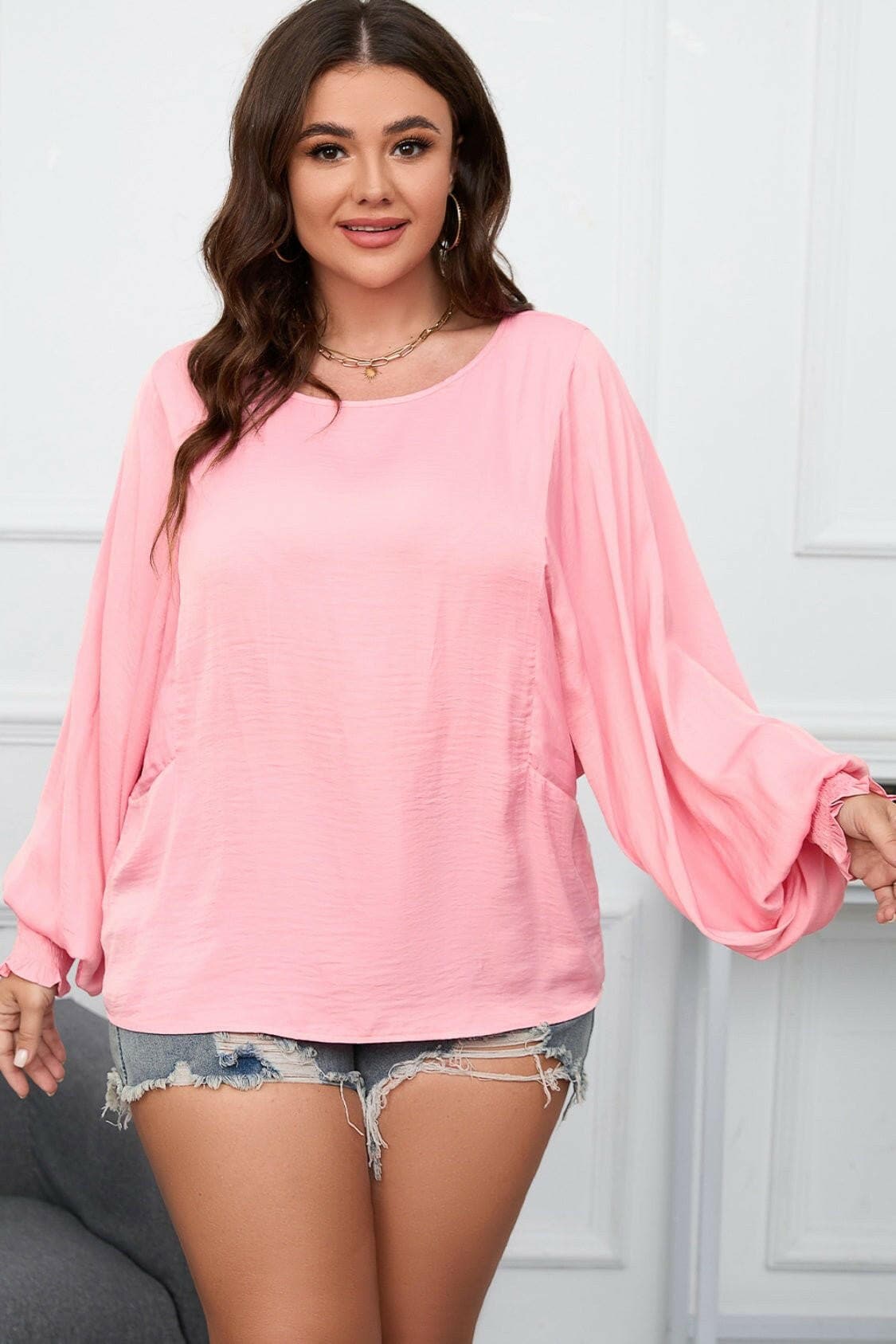 Chic oversized lantern sleeve top for curvy women in pink.