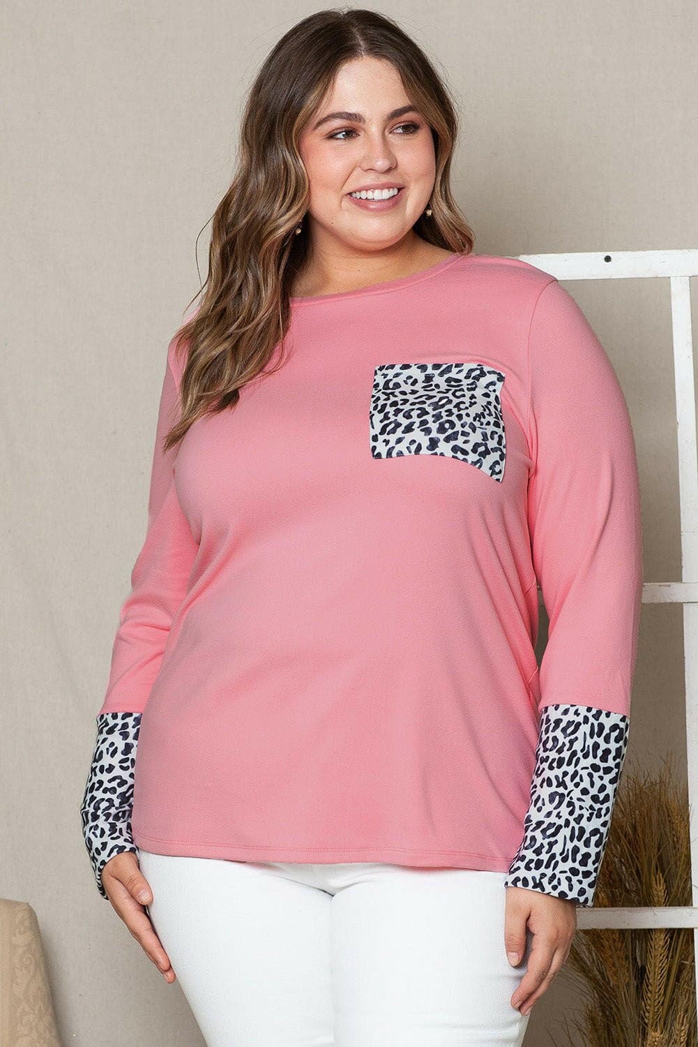 Leopard print sheer plus size tunic with pockets and stretchy material.