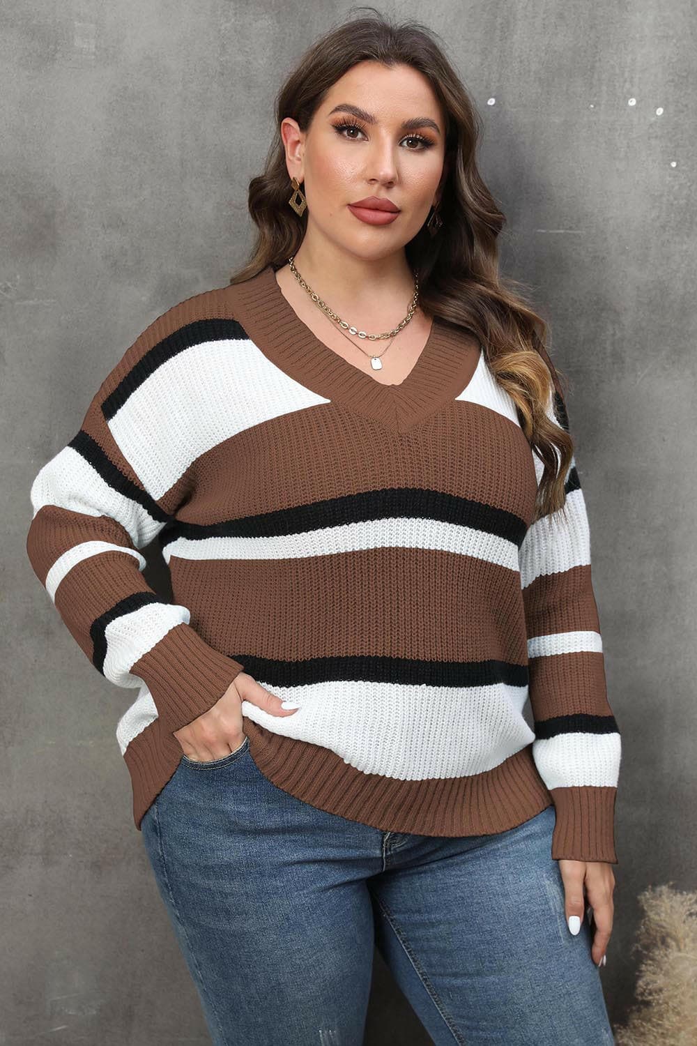 Cozy Striped V-Neck Oversized SweaterStay Stylish and Comfy with Our Cozy Striped V-Neck Oversized Sweater
 Upgrade your wardrobe with our Cozy Striped V-Neck Oversized Sweater, perfect for both lounginLove Salve -Neck Oversized Sweaterplus