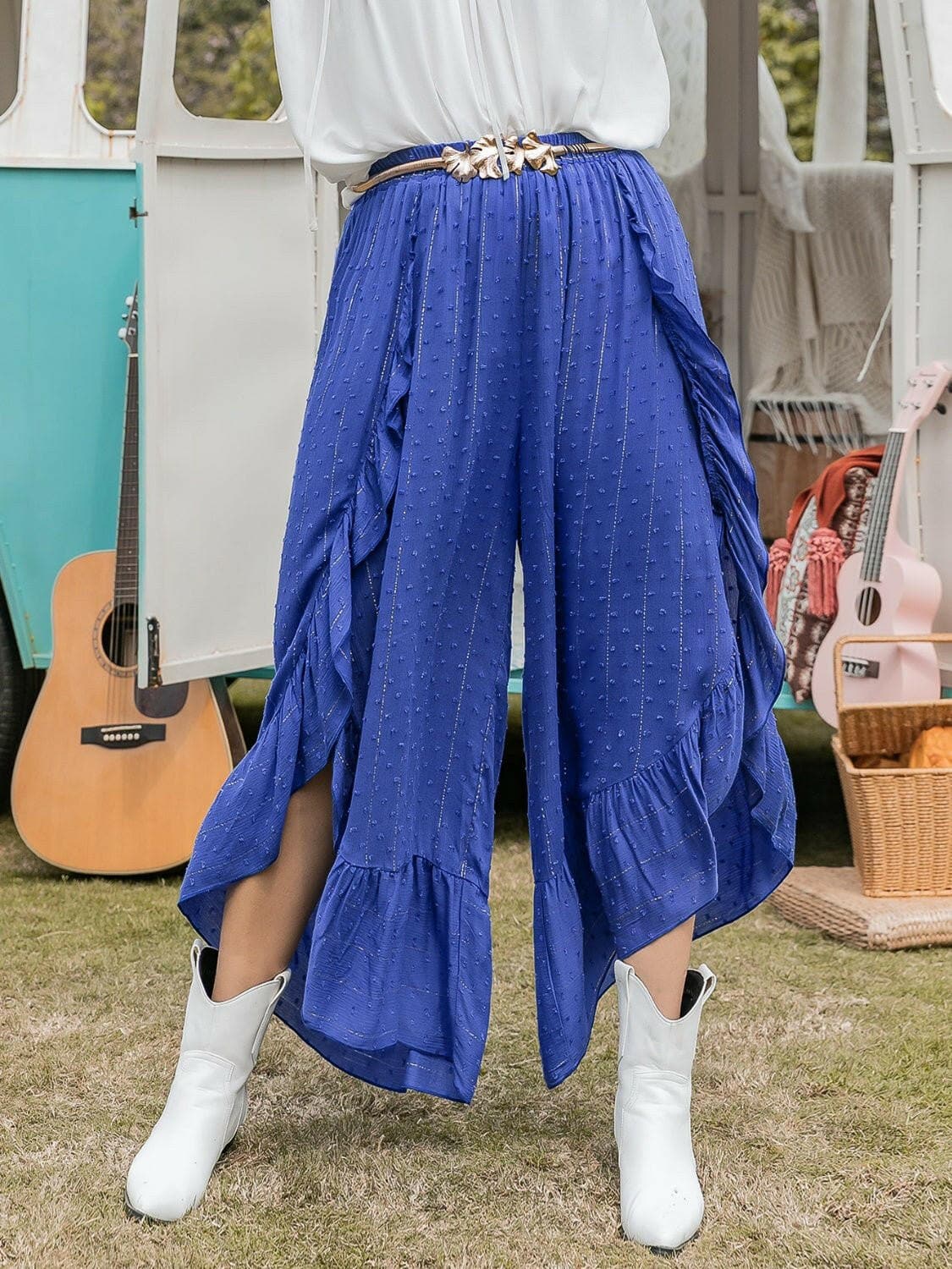 Elegant Swiss dot wide leg ruffled pants with sheer slit detail in vibrant blue.