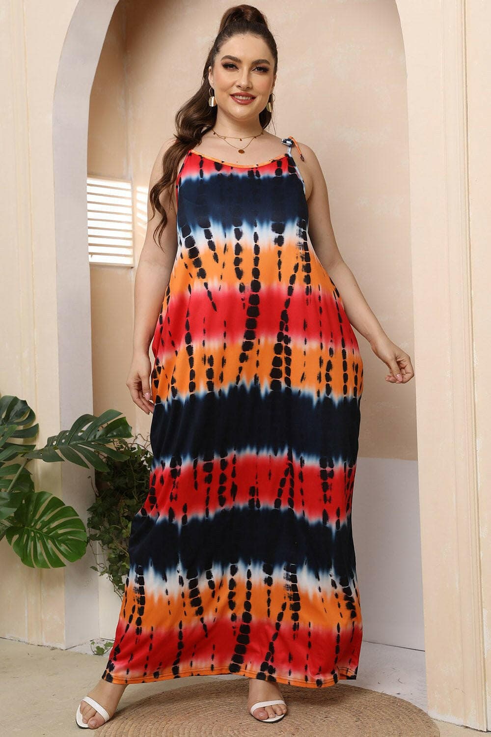 Curvy tie-shoulder maxi dress with colorful pattern, perfect for curvy ladies.