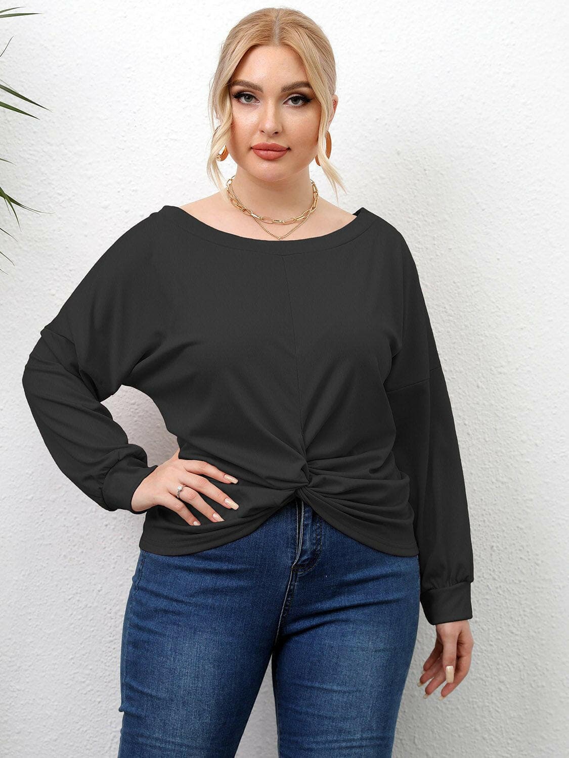 Curvy twist drop shoulder tee with sheer twisted design and stretchy opaque fabric.