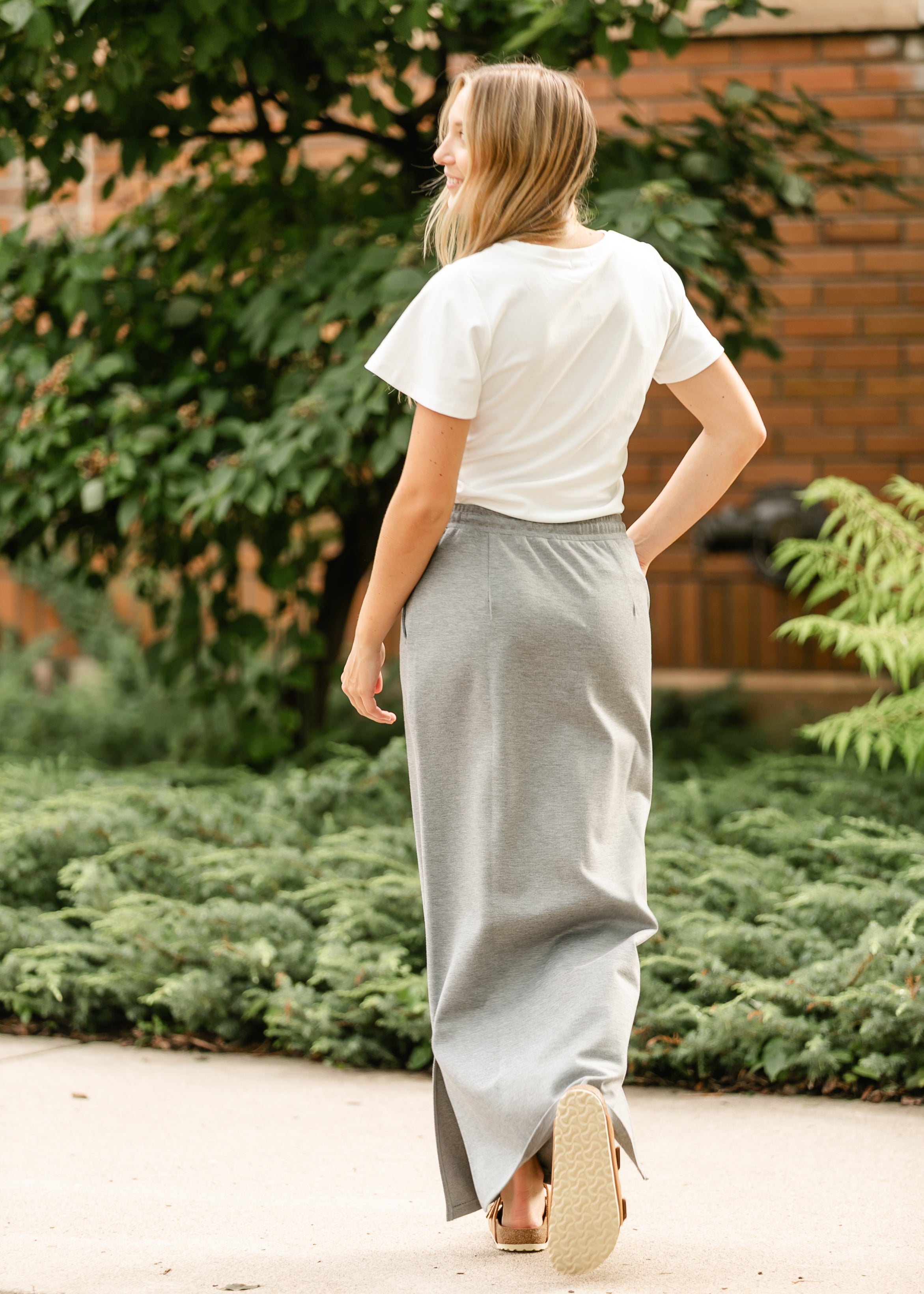 Inherit Co. Jordan Knit Maxi Skirt in a lifestyle setting, showing its natural movement and how it pairs with other apparel.