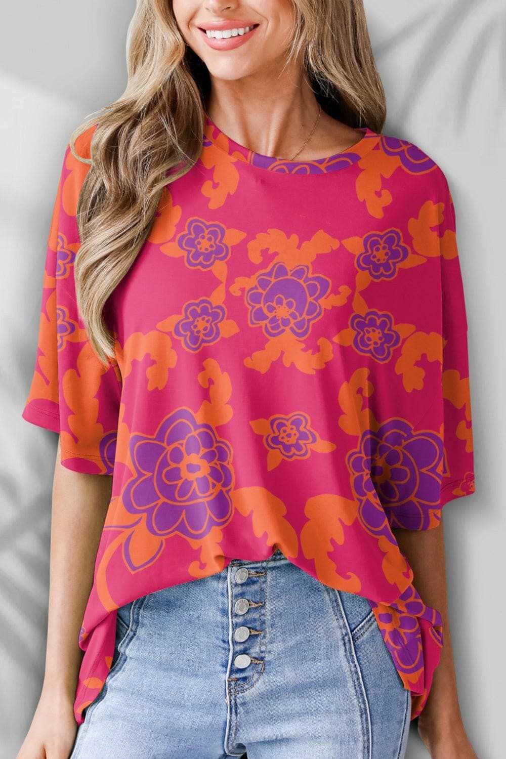 Vibrant floral printed short sleeve tee with round neck, perfect for casual fashion.