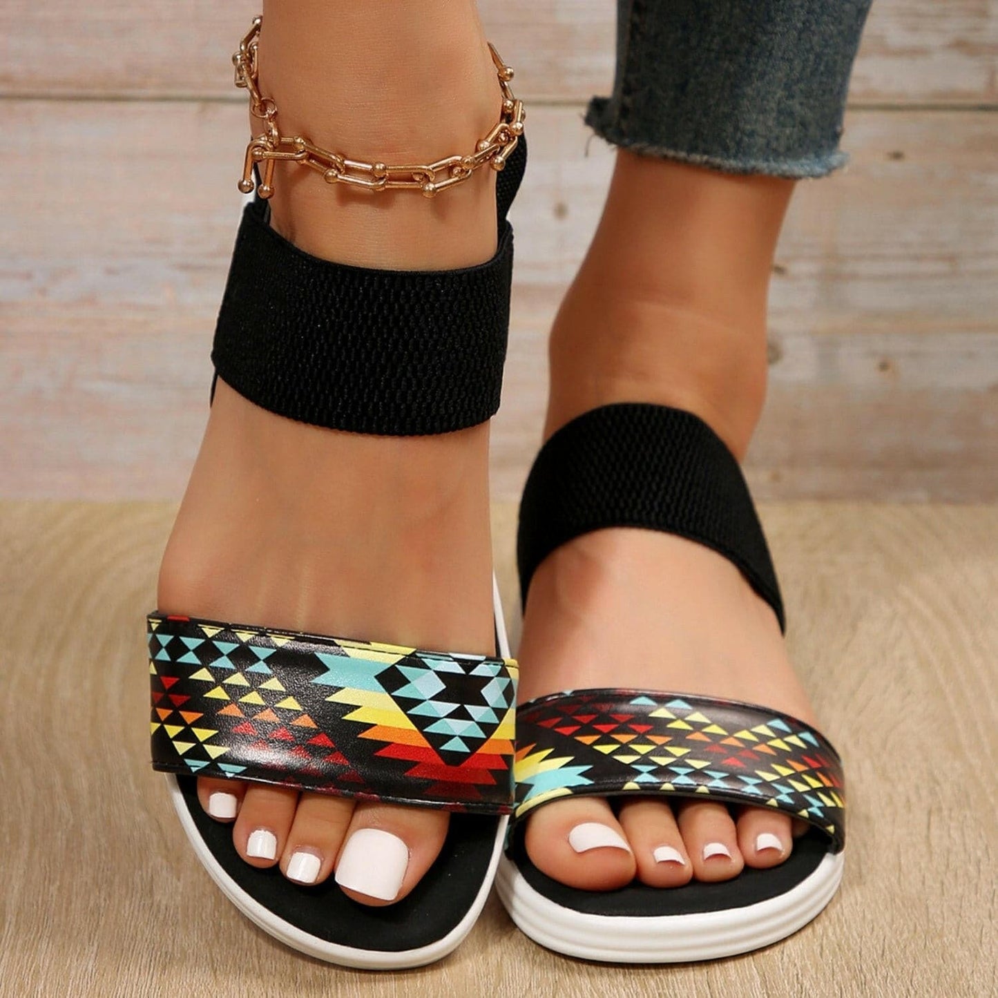 Stylish open toe low heel sandals in colorful geometric pattern with ankle strap, crafted in PU leather.