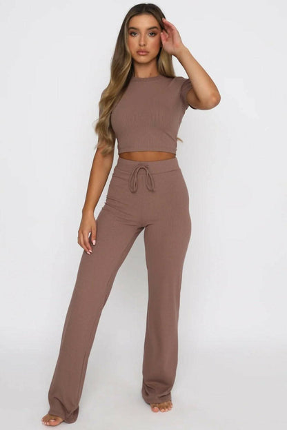 Cozy two-piece lounge set with short-sleeve top and drawstring pants in brown.