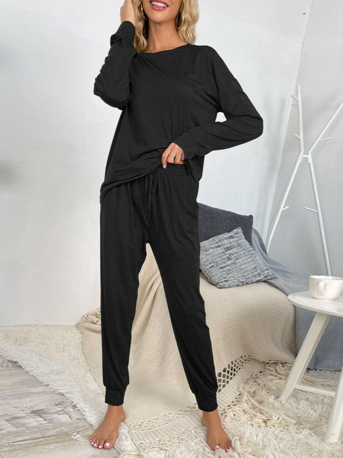 Lounge in Style: Round Neck Top and Drawstring Pants SetIndulge in Comfort and Style
 Upgrade your loungewear game with our Lounge in Style Set, featuring a chic Round Neck Top and ultra-comfortable Drawstring Pants. WhetLove Salve Round Neck Toplounge