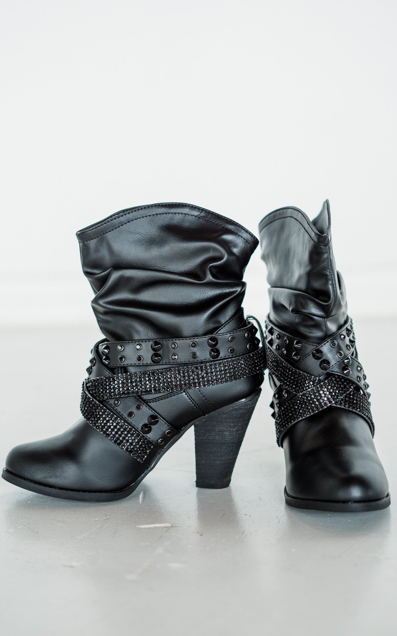 Short Change Black Booties With Studded Straps And Cushioned Footbed