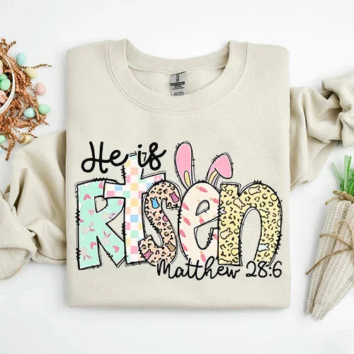Adorb.co He is Risen Easter Inspirational Sweatshirt, a detailed view of the "He is Risen" text and cross design.