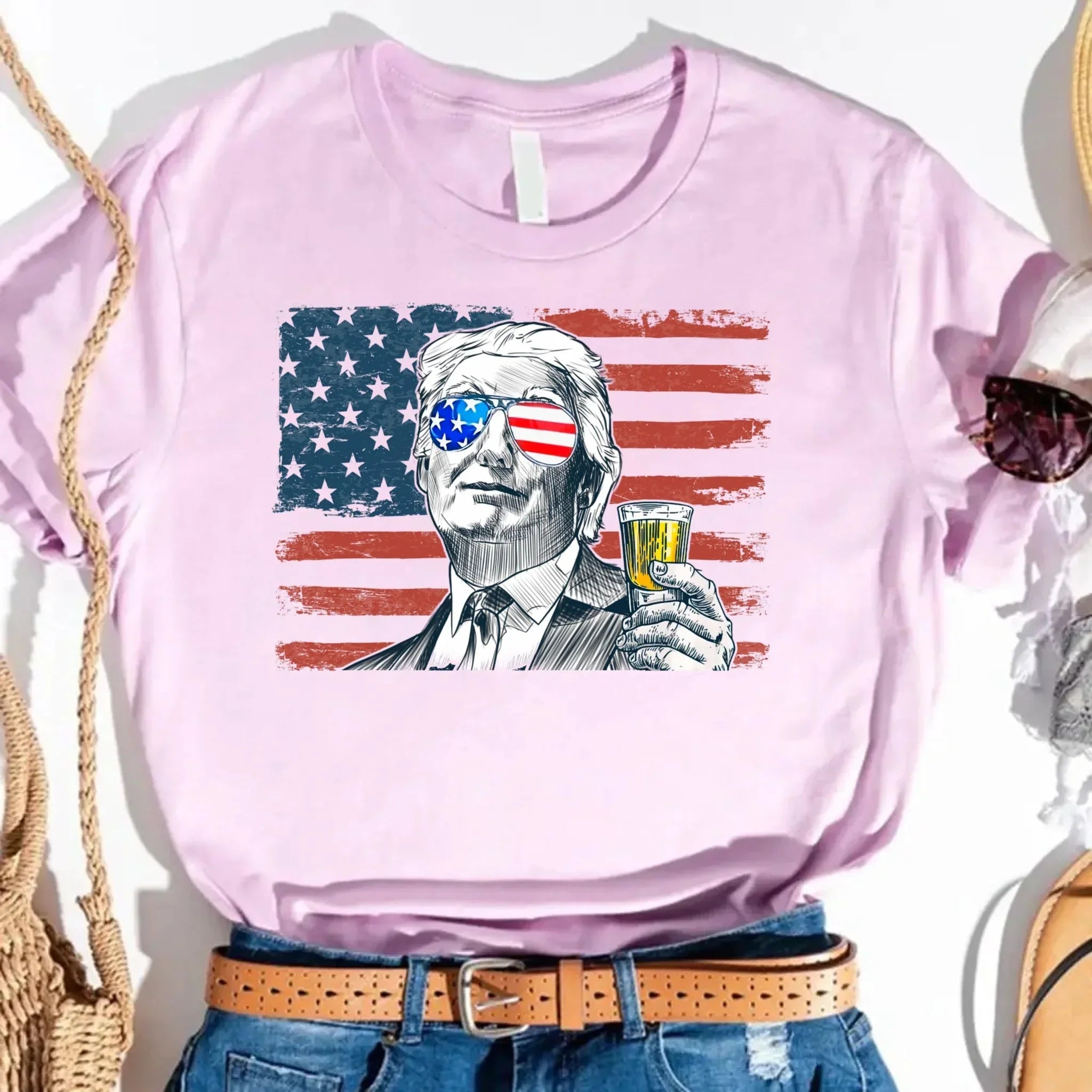 A model laughing while wearing the Adorb.co Donald Trump drinking party shirt, conveying the fun and humorous style of the te