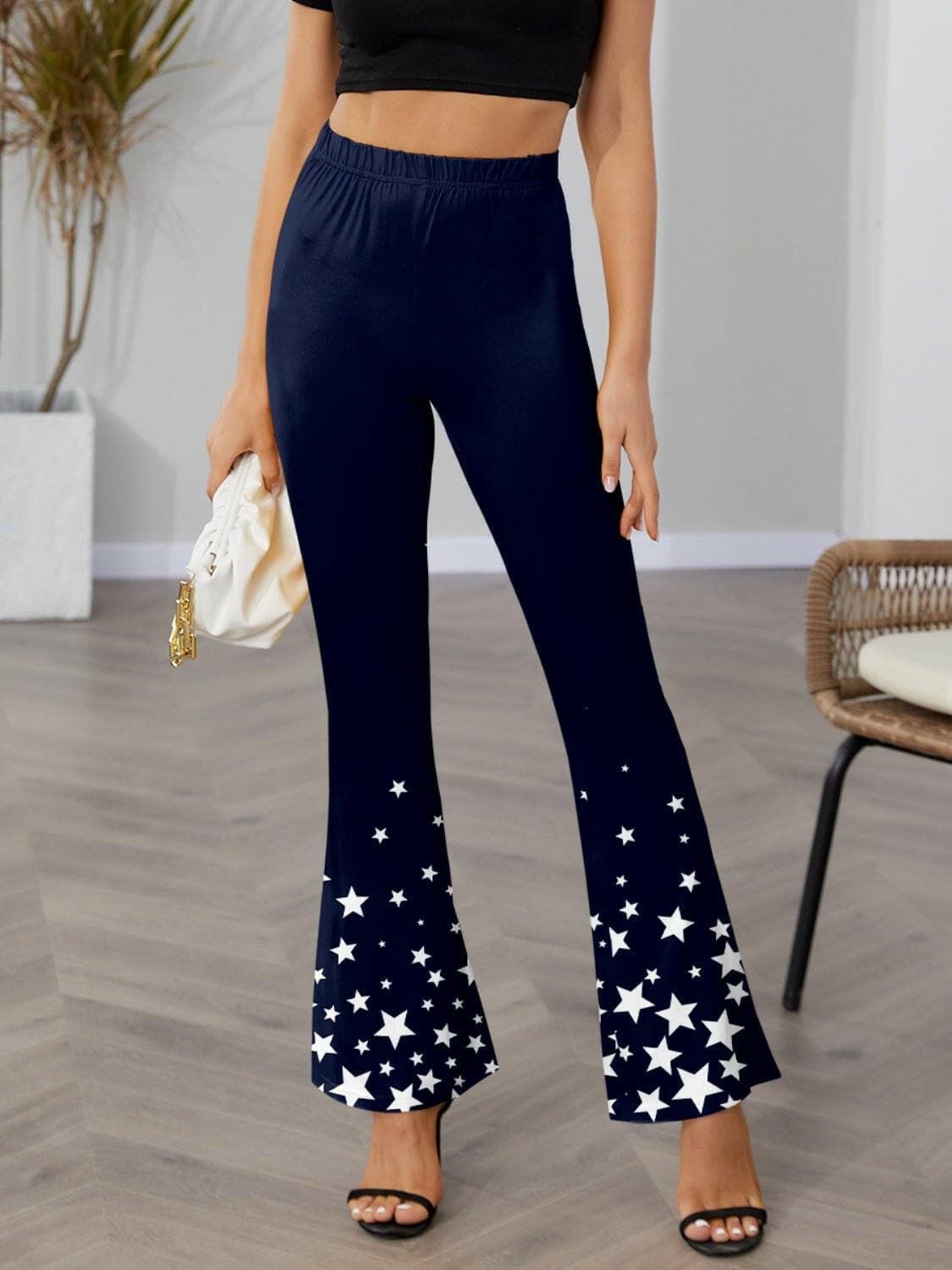 Twinkle Elastic Waist Flared Pants in navy with star pattern, featuring a flattering flared design.