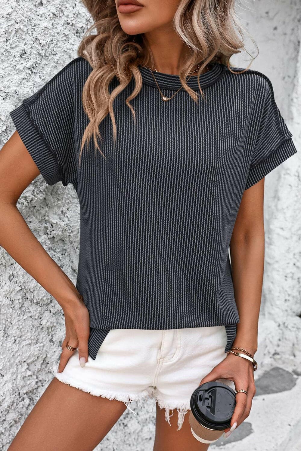 Chic striped ribbed tee with exposed seams, round neck, short sleeves.