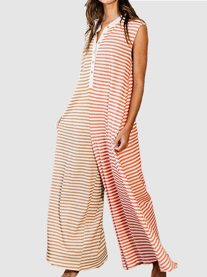 Chic striped sleeveless jumpsuit with buttoned detailing and sheer stripes.