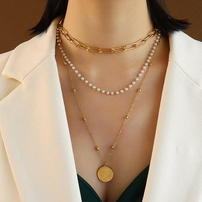 Three-Layered Synthetic Pearl Necklace with Titanium Steel ChainThree-Layered Synthetic Pearl Necklace with Titanium Steel Chain
 Indulge in sophistication and elevate your style with our Three-Layered Synthetic Pearl Necklace. TLove Salve -Layered Synthetic Pearl Necklacejust arrived