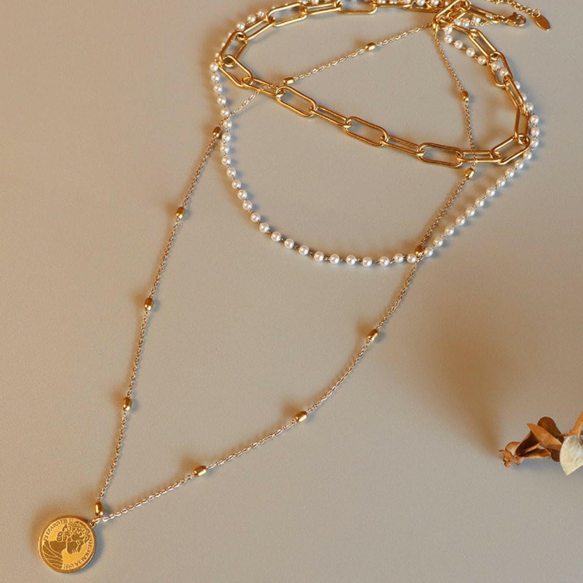 Three-Layered Synthetic Pearl Necklace with Titanium Steel ChainThree-Layered Synthetic Pearl Necklace with Titanium Steel Chain
 Indulge in sophistication and elevate your style with our Three-Layered Synthetic Pearl Necklace. TLove Salve -Layered Synthetic Pearl Necklacejust arrived