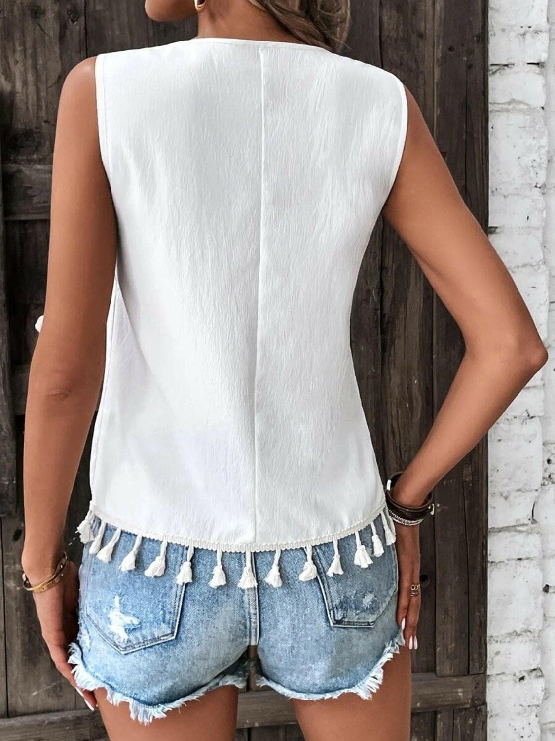 Tassel Detail V-Neck Sheer Tank TopExperience Effortless Elegance with Our Tassel Detail V-Neck Sheer Tank Top
 Indulge in sheer sophistication with our Tassel Detail V-Neck Sheer Tank Top, a versatilLove Salve -Neck Sheer Tank Topjust arrived