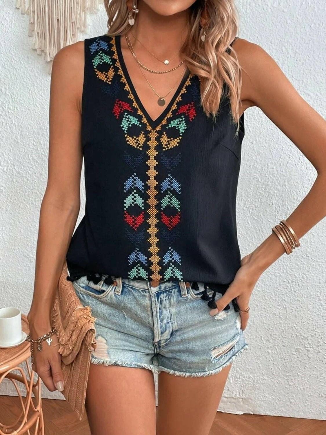 Tassel Detail V-Neck Sheer Tank TopExperience Effortless Elegance with Our Tassel Detail V-Neck Sheer Tank Top
 Indulge in sheer sophistication with our Tassel Detail V-Neck Sheer Tank Top, a versatilLove Salve -Neck Sheer Tank Topjust arrived