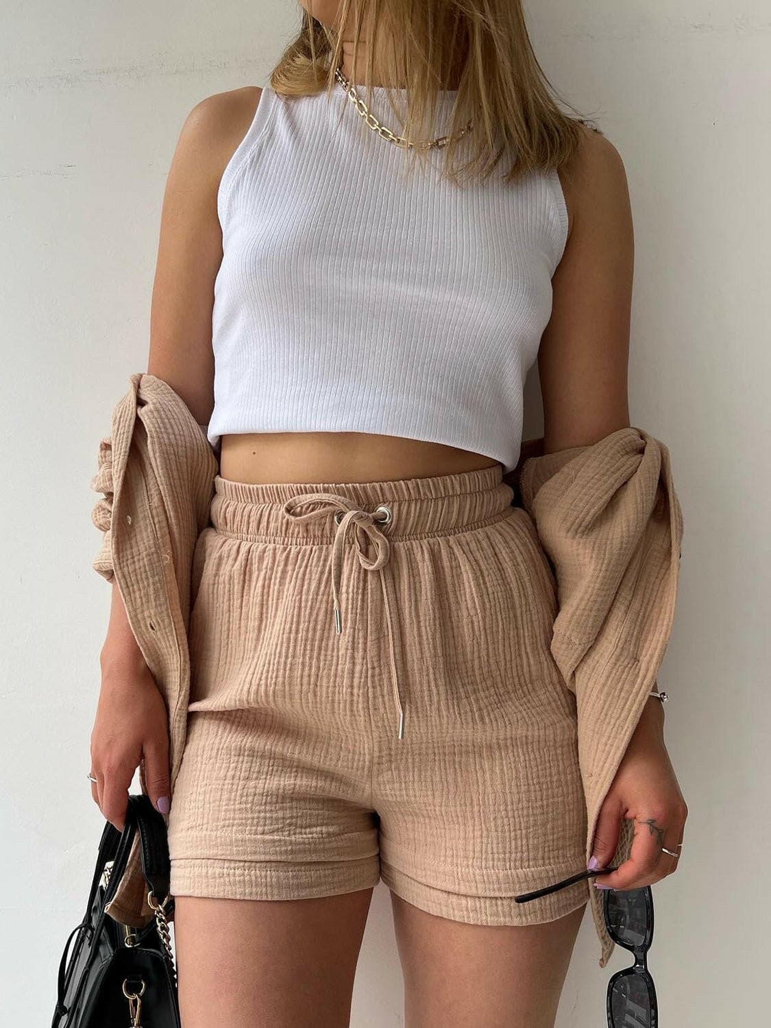 Chic Textured Shirt and Drawstring Shorts EnsembleChic Textured Shirt and Drawstring Shorts Ensemble
 Upgrade your style effortlessly with our chic textured shirt and drawstring shorts ensemble. Embrace a modern andLove Salve Chic Textured ShirtColor