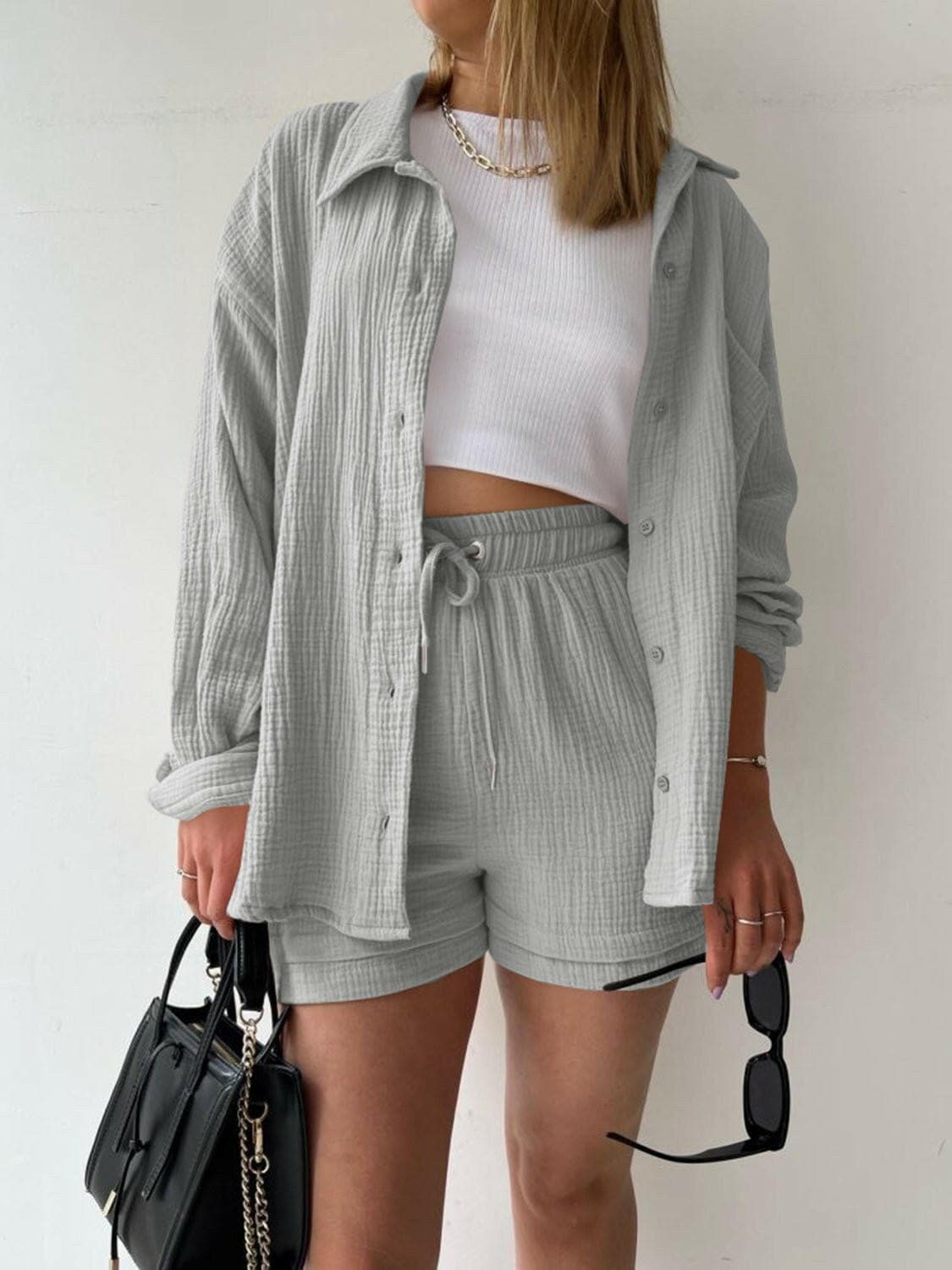 Chic Textured Shirt and Drawstring Shorts EnsembleChic Textured Shirt and Drawstring Shorts Ensemble
 Upgrade your style effortlessly with our chic textured shirt and drawstring shorts ensemble. Embrace a modern andLove Salve Chic Textured ShirtColor