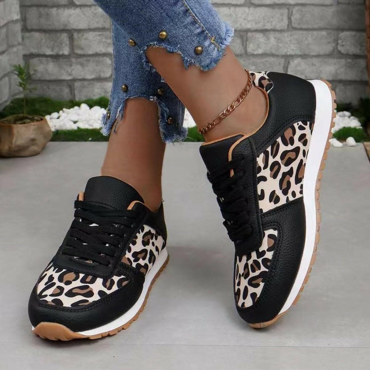 Athletic printed PU leather sandals for women, chic design with comfortable flat heel.