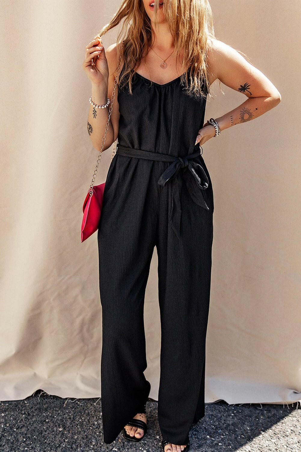 V-Neck Tie-Up Strappy JumpsuitV-Neck Tie-Up Strappy Jumpsuit
 Step into elegance and sophistication with our V-Neck Tie-Up Strappy Jumpsuit. Elevate your wardrobe with this stylish piece that offLove Salve -Neck Tie-just arrived