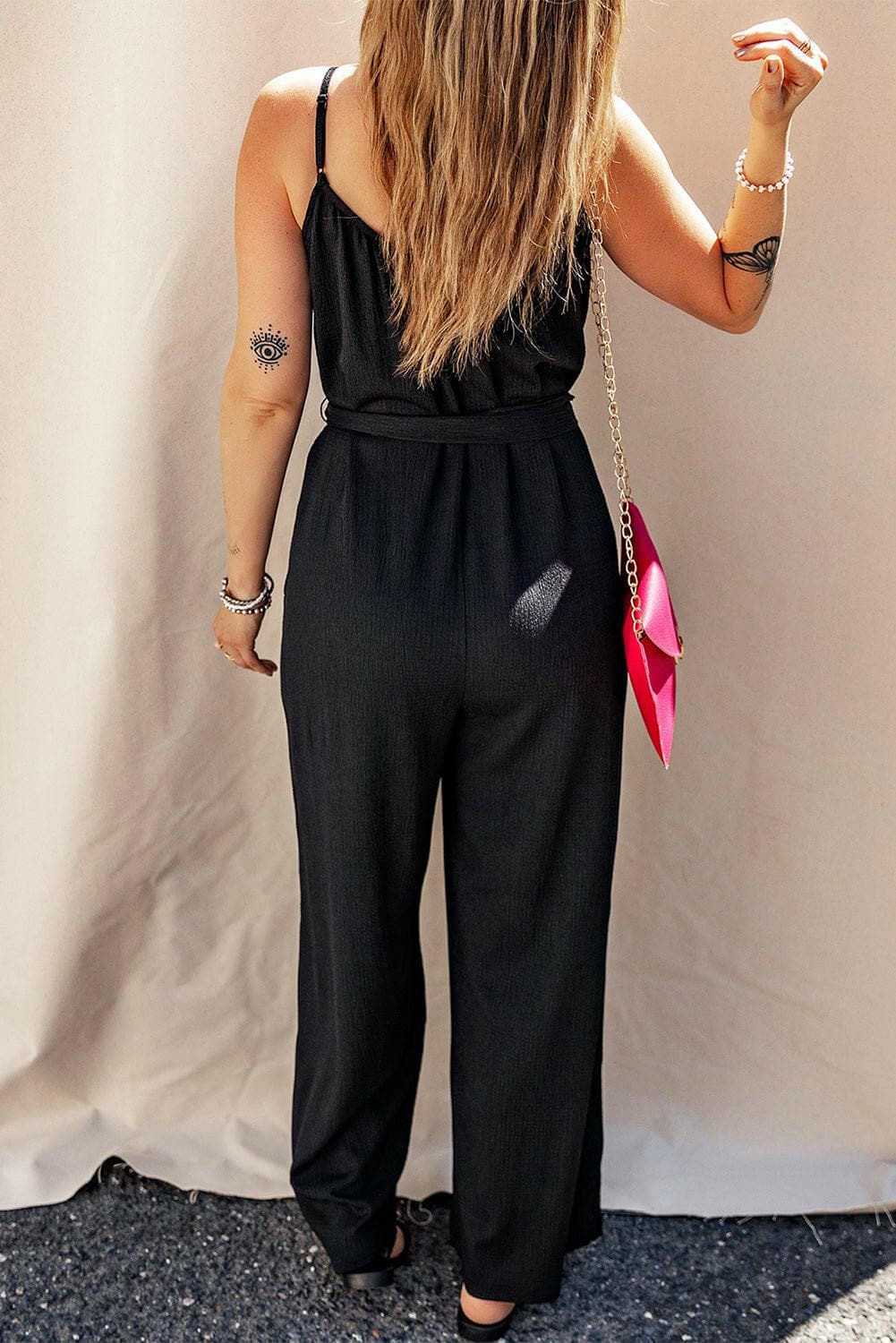 V-Neck Tie-Up Strappy JumpsuitV-Neck Tie-Up Strappy Jumpsuit
 Step into elegance and sophistication with our V-Neck Tie-Up Strappy Jumpsuit. Elevate your wardrobe with this stylish piece that offLove Salve -Neck Tie-just arrived