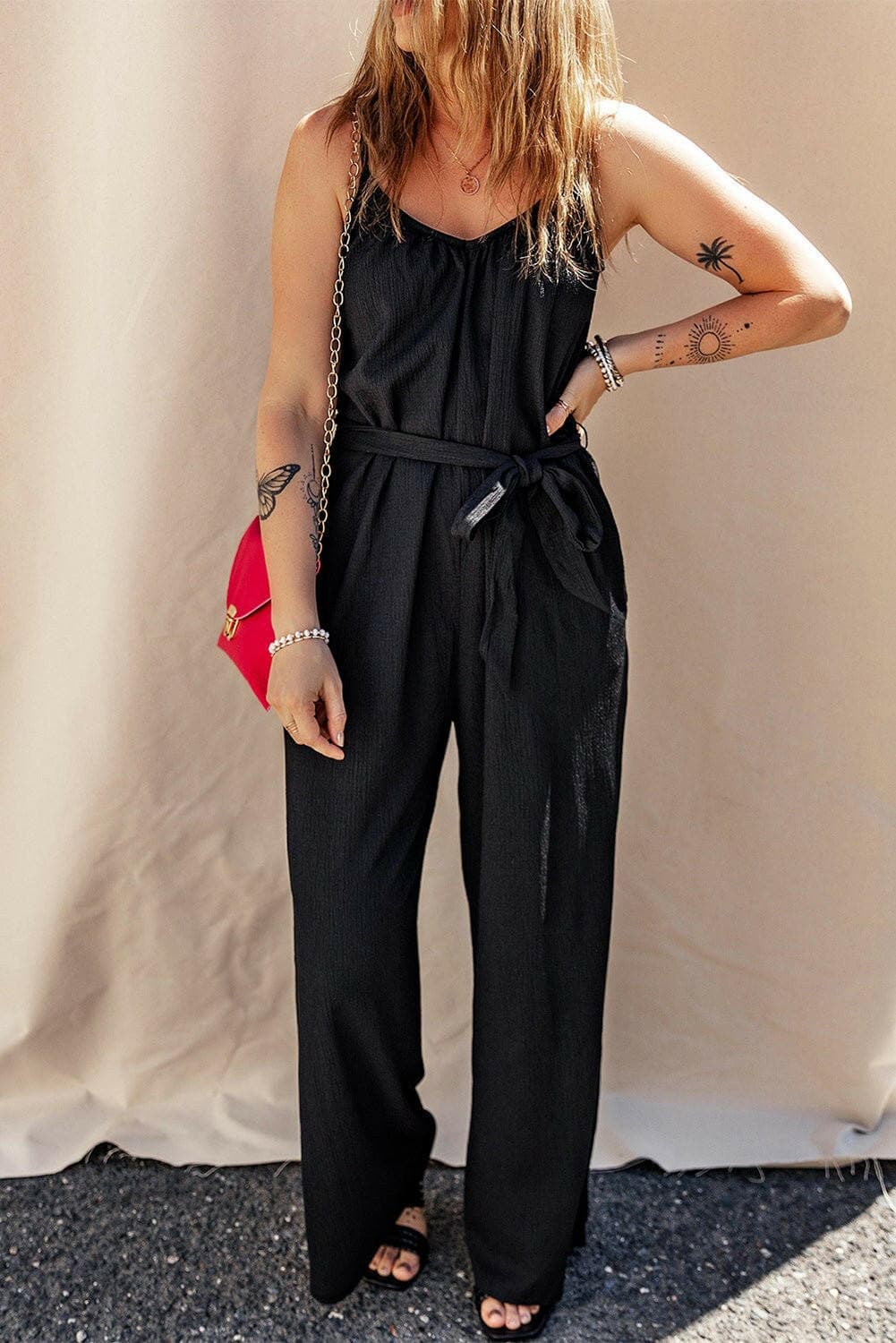 V-Neck Tie-Up Strappy JumpsuitV-Neck Tie-Up Strappy Jumpsuit
 Step into elegance and sophistication with our V-Neck Tie-Up Strappy Jumpsuit. Elevate your wardrobe with this stylish piece that offLove Salve -Neck Tie-just arrived