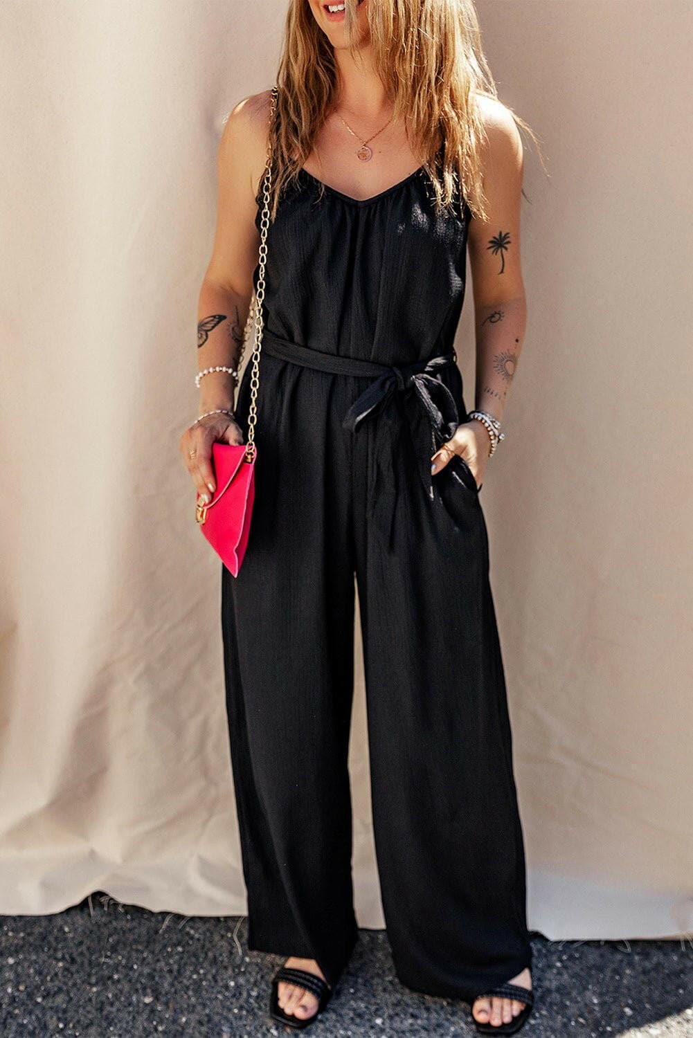 V-Neck Tie-Up Strappy JumpsuitV-Neck Tie-Up Strappy Jumpsuit
 Step into elegance and sophistication with our V-Neck Tie-Up Strappy Jumpsuit. Elevate your wardrobe with this stylish piece that offLove Salve -Neck Tie-just arrived