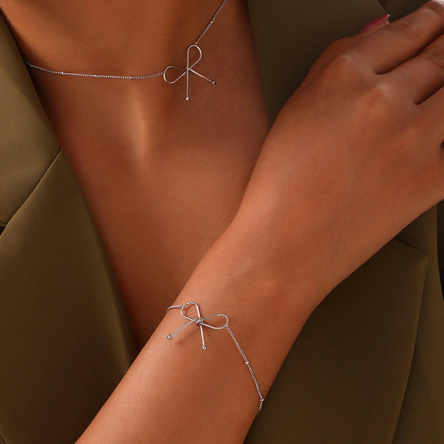 Bow Bracelet made with Titanium Steel & Plated in Silver, Rose Gold, aBow Bracelet made with Titanium Steel &amp; Plated in Silver, Rose Gold, and Gold
 Indulge in elegance with our exquisite Bow Bracelet crafted from durable Titanium Love Salve Silver, Rose Gold,just arrived