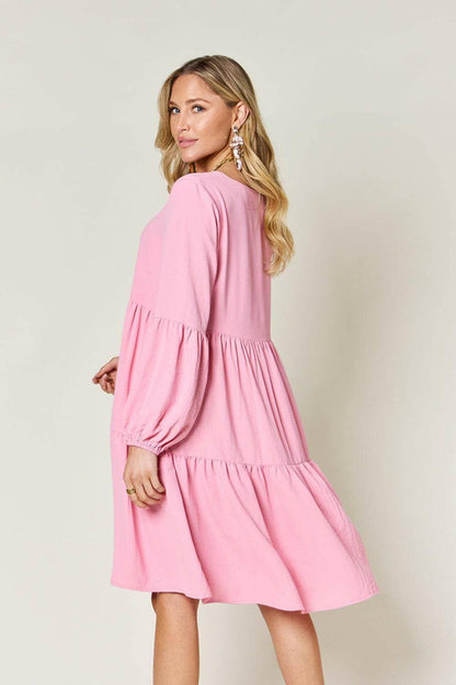 Double Vision V-Neck Balloon Sleeve Tiered DressDouble Vision V-Neck Balloon Sleeve Tiered Dress
 Step into the spotlight with our Double Vision V-Neck Balloon Sleeve Tiered Dress, a masterpiece designed to turn hLove Salve -Neck Balloon Sleeve Tiered DressColor