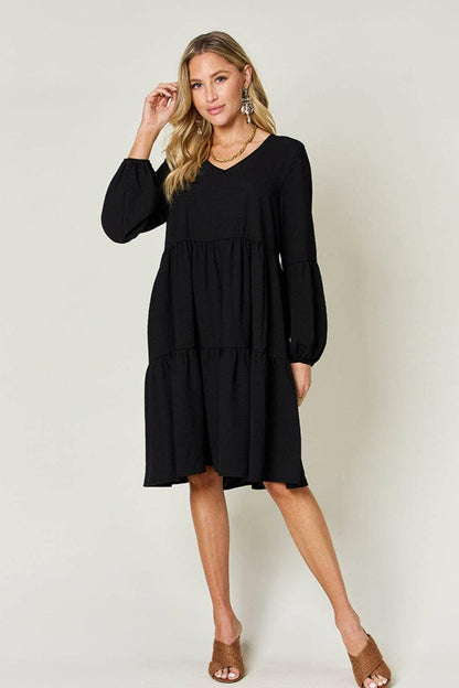 Double Vision V-Neck Balloon Sleeve Tiered DressDouble Vision V-Neck Balloon Sleeve Tiered Dress
 Step into the spotlight with our Double Vision V-Neck Balloon Sleeve Tiered Dress, a masterpiece designed to turn hLove Salve -Neck Balloon Sleeve Tiered DressColor