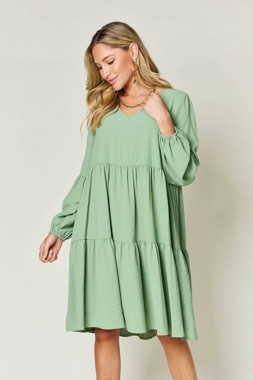 Double Vision V-Neck Balloon Sleeve Tiered DressDouble Vision V-Neck Balloon Sleeve Tiered Dress
 Step into the spotlight with our Double Vision V-Neck Balloon Sleeve Tiered Dress, a masterpiece designed to turn hLove Salve -Neck Balloon Sleeve Tiered DressColor