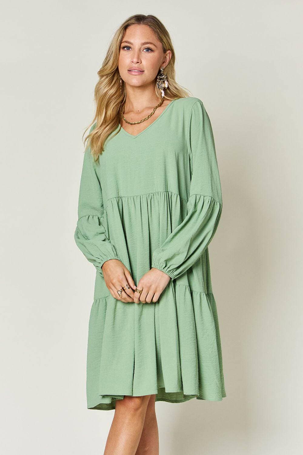 Double Vision V-Neck Balloon Sleeve Tiered DressDouble Vision V-Neck Balloon Sleeve Tiered Dress
 Step into the spotlight with our Double Vision V-Neck Balloon Sleeve Tiered Dress, a masterpiece designed to turn hLove Salve -Neck Balloon Sleeve Tiered DressColor